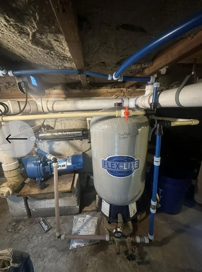 Well water system installation with tank and piping